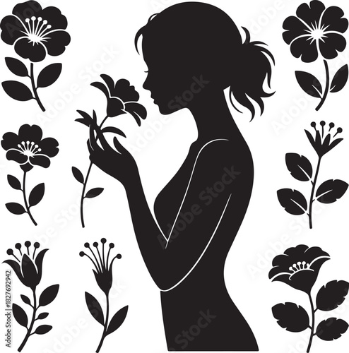 Elegant silhouette of a woman smelling a flower surrounded by blossoms