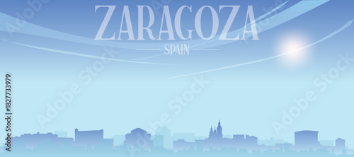 Blue panoramic poster of the city skyline with misty background buildings and clouds of ZARAGOZA, SPAIN