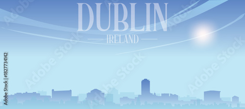 Blue panoramic poster of the city skyline with misty background buildings and clouds of DUBLIN, IRELAND