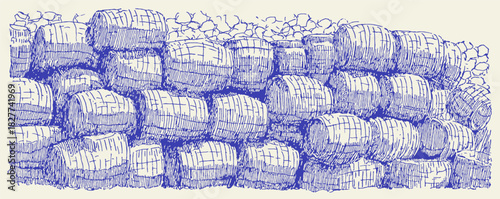 A wall made of hay bales. The hay bales are stacked in a row. The wall is blue. vector illustration