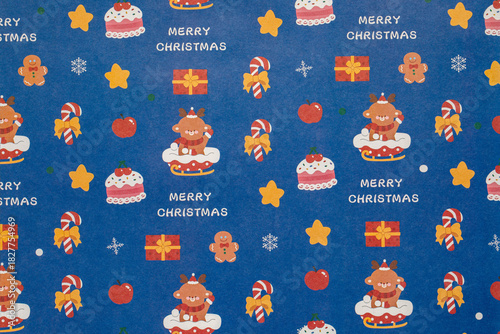 blue christmas background with sreindeer and snowflakes and cake,seamless pattern of candy cane and apple and gifts on blue background,Christmas wrapping paper, Xmas pattern with ornaments.