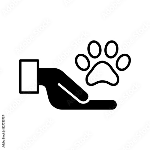 Hand giving treat to pet