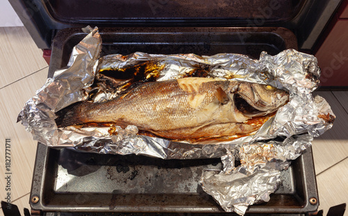 Freshly baked lavraky fish in a foil