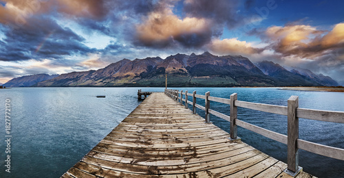 Panoramic view of Wakatipu Lake from Glenorchy pier at sunrise in New Zealand
