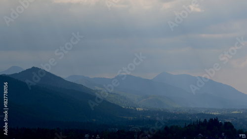Fototapeta Naklejka Na Ścianę i Meble -  Dark clouds over the Tatra Mountains, Poland. Beautiful, scenic panoramic view with High Tatra summits. Landscape from Cyrhla village