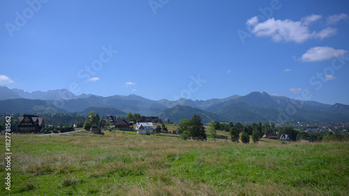 Fototapeta Naklejka Na Ścianę i Meble -  Fantastic view of the Tatra Mountains, located off the beaten track. Tatra Mountains viewpoint near Zakopane - Gawlaki Walkosze street, Poland