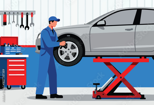 A mechanic in blue overalls checks a car tire lifted by a red jack in a workshop, tools hanging