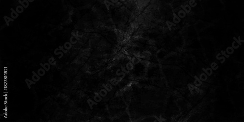Black dark grunge stone texture with rough, natural crack wall surface background. uneven pattern resembling weathered black rock or charcoal. Panorama black canvas slate texture. marble background.