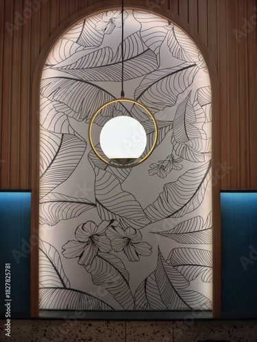 Bilde på lerret A stylish interior wall feature, combining natural wood panels, a modern spherical light fixture within a golden ring, and a captivating botanical line art wallpaper