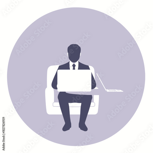 Silhouette of a businessman in a suit working on a laptop while sitting in a chair.