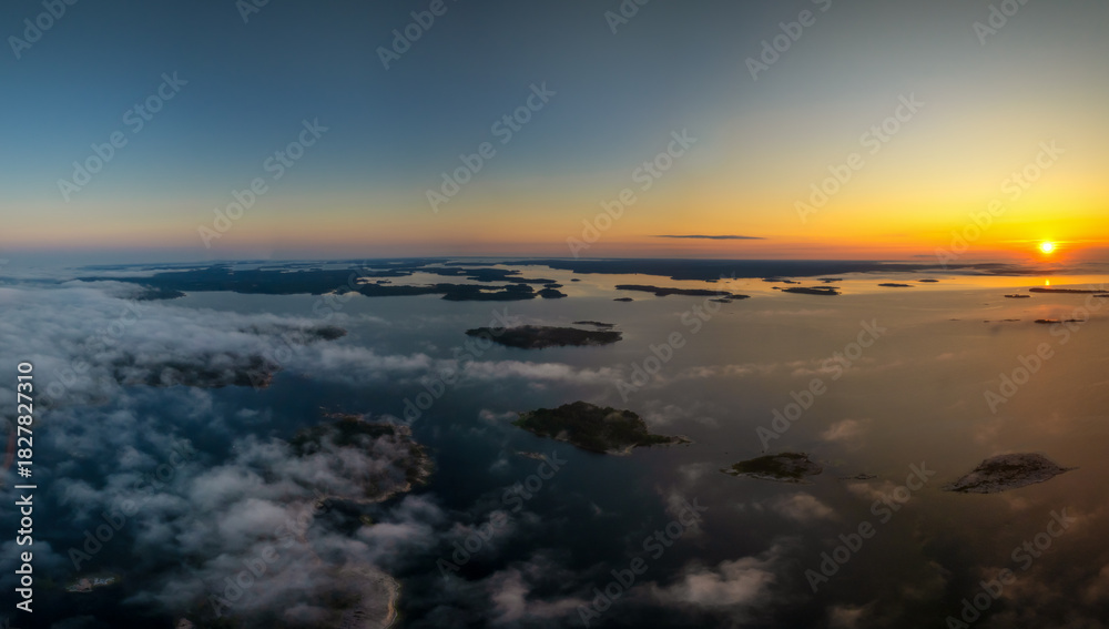 Naklejka premium aerial panorama view of a beautiful sunset over the skerries and islands of the Aland archipelago in the Baltic Sea