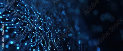 Close-up of illuminated blue circuitry paths on a dark background