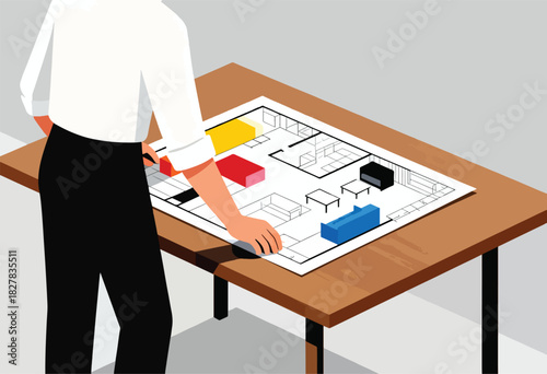 An individual in white shirt and black pants is leaning over a table with a building blueprint