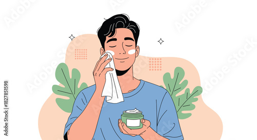 A happy young man performing his daily skincare routine, gently applying cream to his face with a towel for a fresh look.