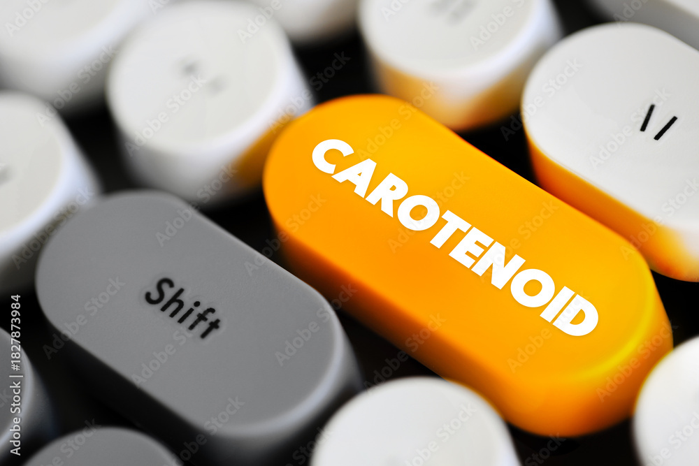 Naklejka premium Carotenoid - tetraterpene pigments, which exhibit yellow, orange, red and purple colors, text concept button on keyboard
