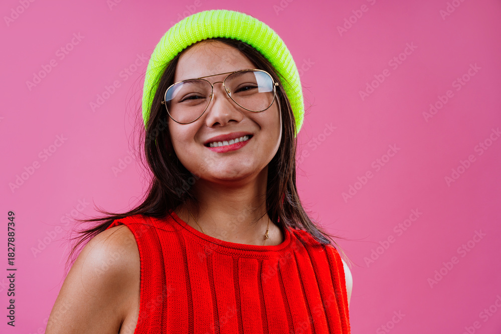 Fototapeta premium Stylish young woman laughing with colorful fashion accessories