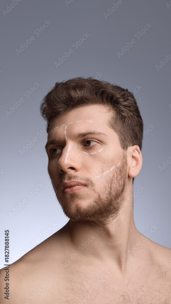 Naklejka premium Male face with directional contour markings for structural guidance. Concept of educational mapping diagrams, clinic explanations, cosmetic planning visuals, and jaw-cheek guidance.