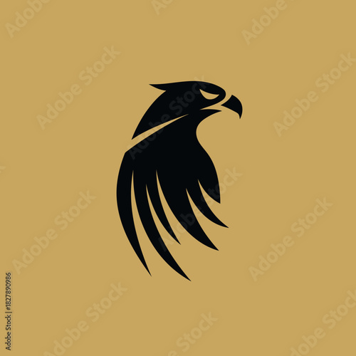 Eagle head silhouette on gold background