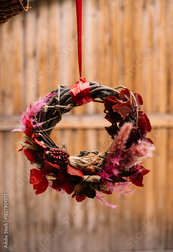 Wallpaper Mural beautiful hand made wreath, decorated with stabilized autumn leaves, hanging on the wooden background, close up vertical image Torontodigital.ca