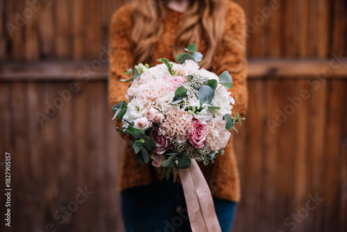 Wallpaper Mural Very nice young woman holding big and beautiful wedding bouquet of fresh freesia, eucalyptus, roses, peonies flowers in pink and white colors Torontodigital.ca