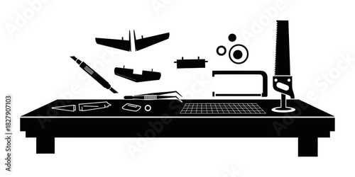 Hobbyists Workbench with Model Airplane Parts and Tools.