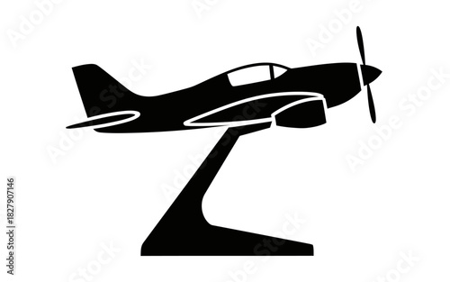 Silhouette of a vintage propeller airplane model on a display stand.