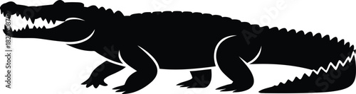 Silhouette of a crocodile with mouth wide open and sharp teeth