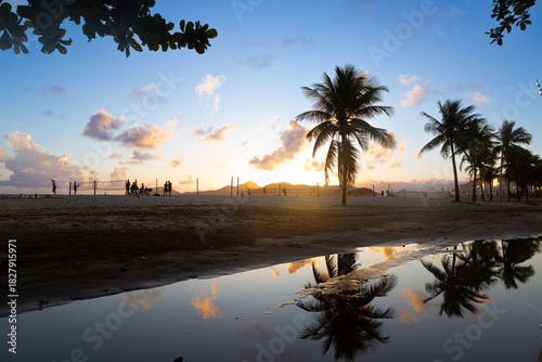 Sunrise Beach Scene with People Playing Sports in Santos, Brazil