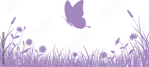 Delicate butterfly flutters over a field of purple wildflowers and grass