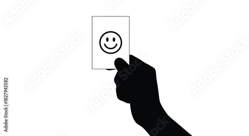 A hand holding a white card with a simple smiling face design