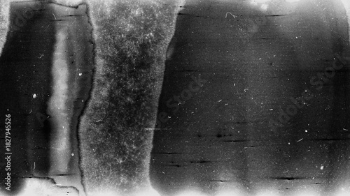 Blank grained film strip texture background with heavy grain, dust and light leak. Old expired moldy photographic film scan.