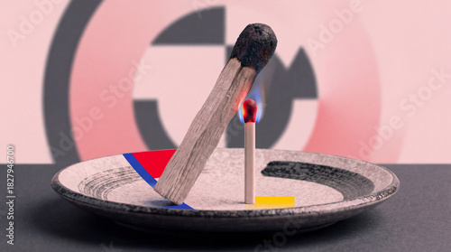 A striking visual of a burning matchstick on a colorful plate against a vibrant background, capturing the dynamic relationship between fire, color, and sensation.