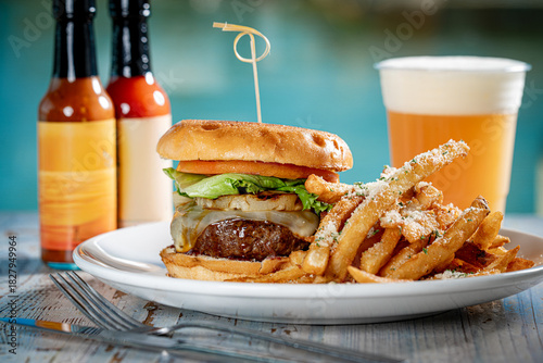 Cheeseburger with grilled pineapple and fries.