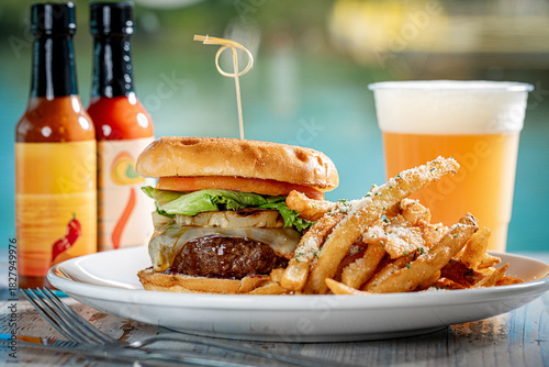 Cheeseburger with grilled pineapple and fries.
