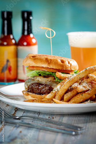 Cheeseburger with grilled pineapple and fries.
