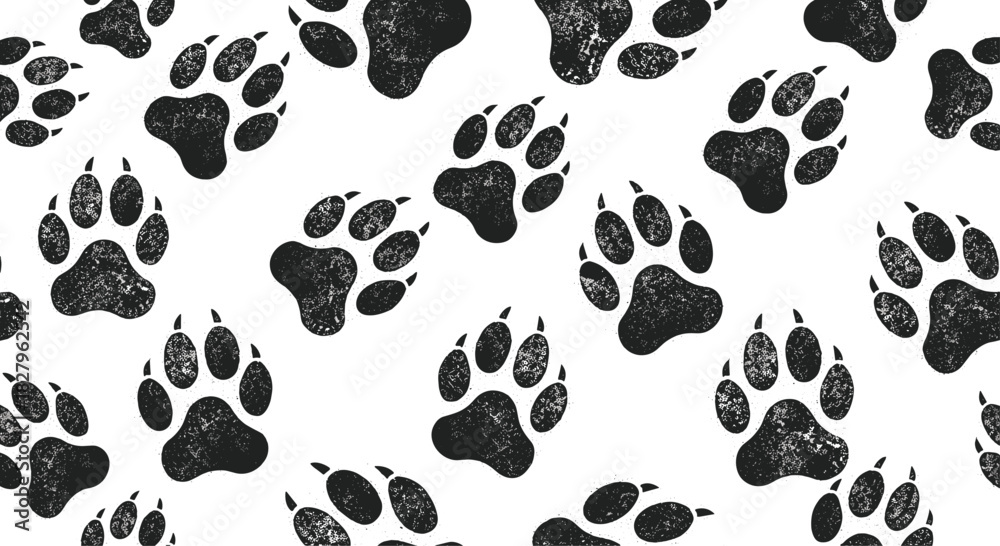 Fototapeta premium Seamless pattern of black grunge-textured bear or dog paw prints scattered randomly across a clean white background vector.
