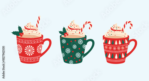 Set of three festive christmas mugs filled with hot chocolate whipped cream and candy canes for a cozy winter holiday treat.