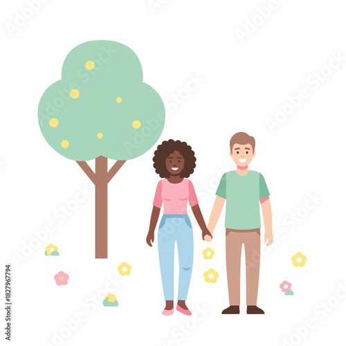 Interracial couple holding hands in a park surrounded by flowers  