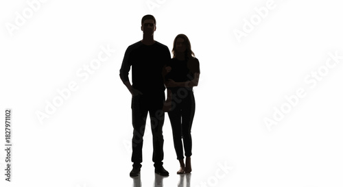 Full body silhouette of a man and woman standing together.
