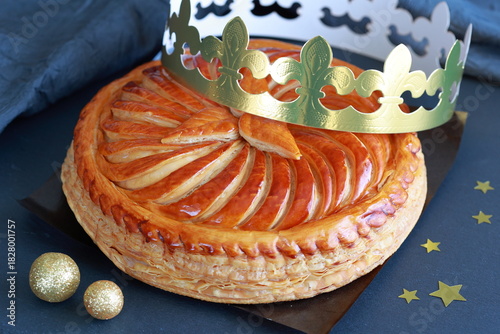 Traditional Galette des Rois with golden crown for  Epiphany celebration.