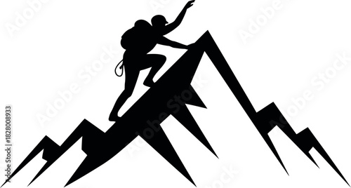 Silhouette of a climber reaching the summit of a jagged mountain peak