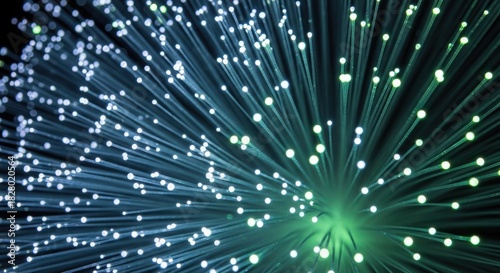 Abstract digital network connections glowing blue and green streaks of light data flow