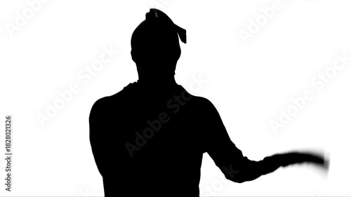 person dancing or exercising in silhouette jumping with a lot of energy clapping with their  hands , real video footage
