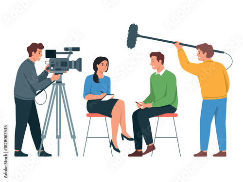 A video crew interviews a man and woman in a studio setting with equipment.