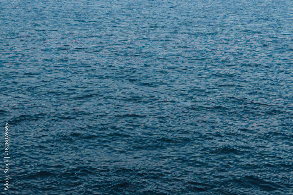 Obraz premium Abstract sunlight blue sea background.