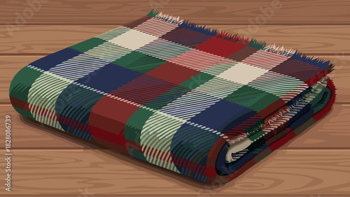 Warm plaid blanket folded on wooden surface  
