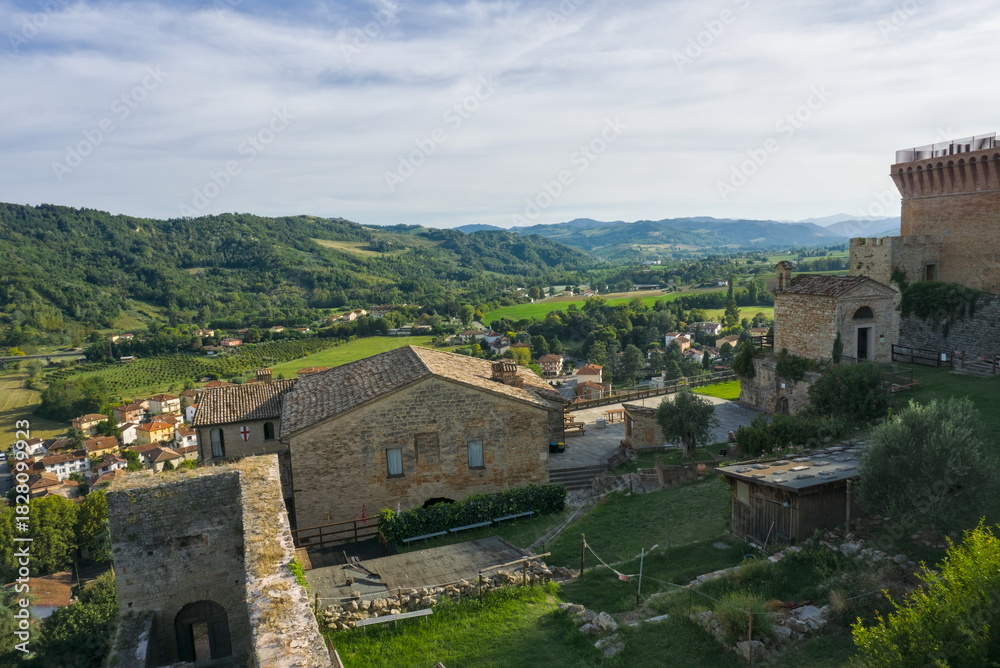 Fototapeta premium High-angle view of the historic Castrocaro Terme Fortress walls and tower overlooking the Romagna countryside.