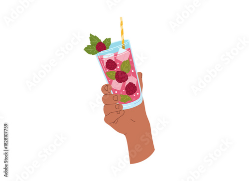 A hand holds a red raspberry drink
