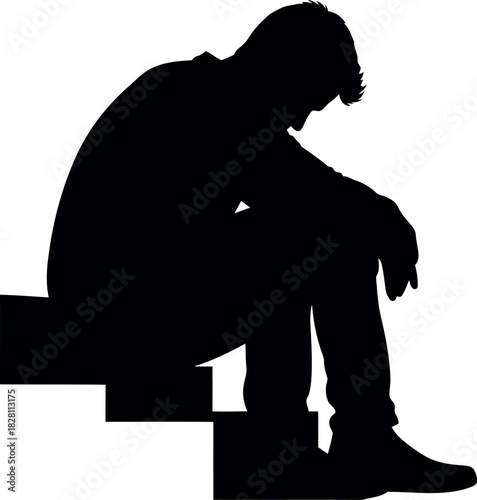 Silhouette of a depressed person sitting alone on steps in sorrow.