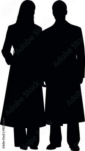Silhouette of adult couple in long coats standing together on white.
